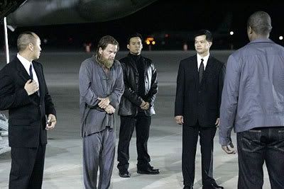 Chinese officials watch as Jack Bauer is released to CTU (Counter-Terrorist Unit) authorities at the start of Day 6.