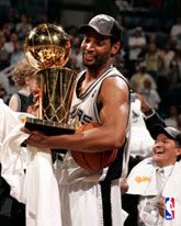 Robert Horry hoists the NBA championship trophy for the San Antonio Spurs.