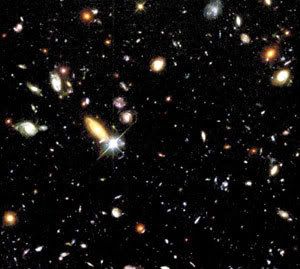 Scores of galaxies grace this photo of the Hubble Deep Field...one of the most popular images taken by the space telescope.