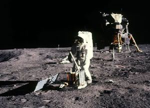 An Apollo astronaut sets up an experiment on the lunar surface