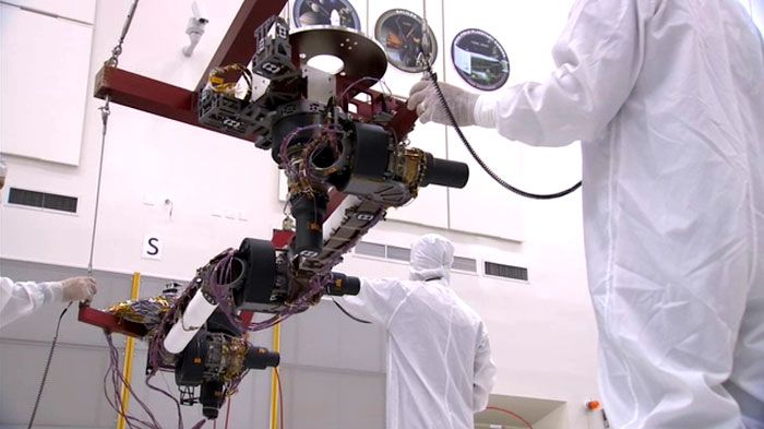 Engineers prepare a robotic arm for installation onto the CURIOSITY Mars Rover at NASA's Jet Propulsion Laboratory in Pasadena, California.
