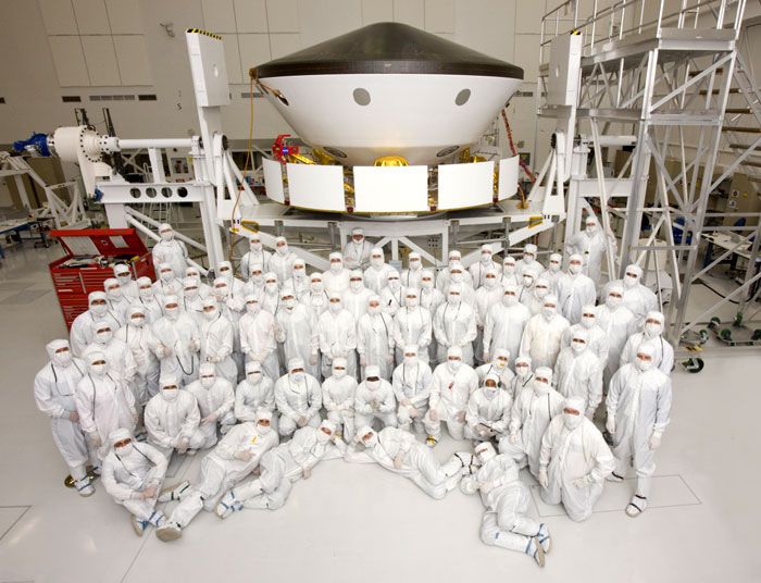 70 members of the Mars Science Laboratory's (MSL) flight team pose for a group photo inside an assembly building at NASA's Jet Propulsion Laboratory in California.