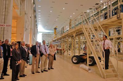 NASA officials take a tour of the Operations and Checkout Building at Florida's Kennedy Space Center.  The OCB will be the facility where the ORION spacecraft is assembled and tested before flight.