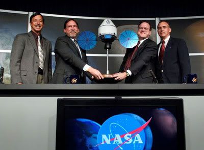 NASA management unveils a miniature mock-up of LOCKHEED MARTIN's Orion spacecraft