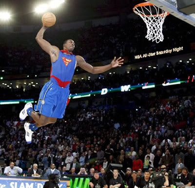 Dressed up like Superman, Dwight Howard makes one of many spectacular dunks that would lead to him winning the 2008 Slam Dunk Contest.