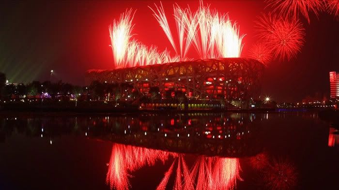 Fireworks erupt above Bird Nest Stadium in Beijing, China, during the Olympic opening ceremony on August 8, 2008.