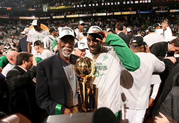 Kevin Garnett and Celtics legend Bill Russell pose with the NBA trophy after Boston wins the championship in Game 6 of the NBA Finals, on June 17, 2008.