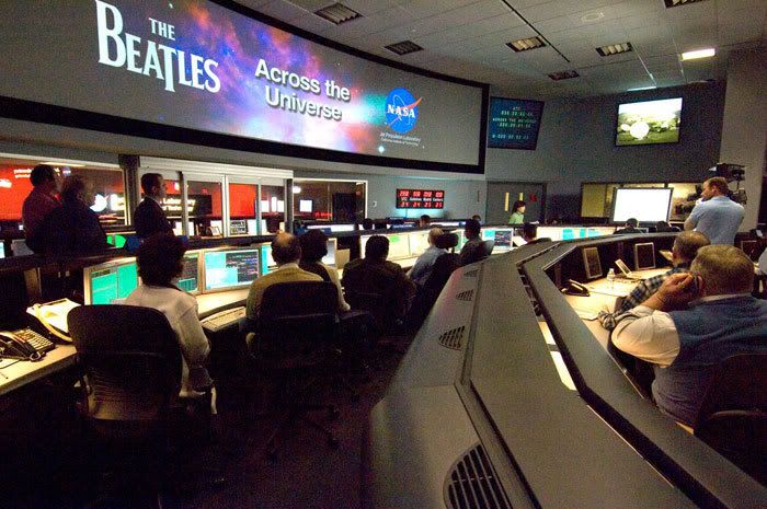 On February 4, 2008, folks in Mission Control at NASA's Jet Propulsion Laboratory in Pasadena, Calif. gaze at monitors indicating that a transmission of the Beatles tune 'Across the Universe' was successfully beamed up into space.