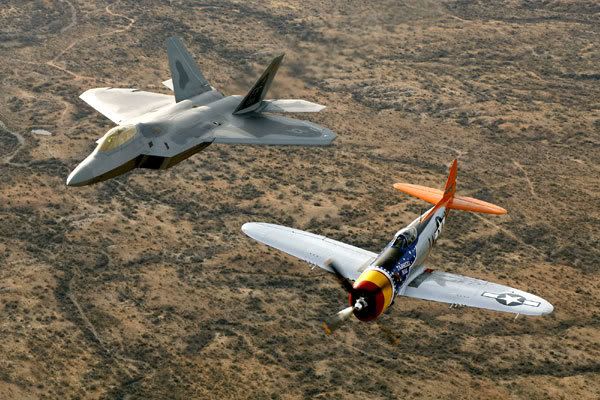An F-22 Raptor and a World War II-era fighter.