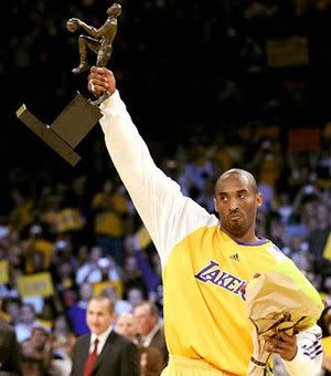 Kobe Bryant hoists up his 2008 NBA MVP trophy.