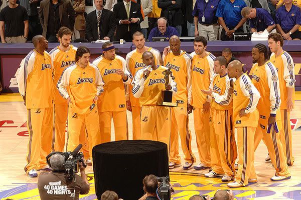 Kobe Bryant's teammates gather around him after he is awarded the 2008 NBA Most Valuable Player trophy at STAPLES Center in Los Angeles last night.  The Lakers then went on to defeat the Utah Jazz, 120-110, in Game 2 of the Western Conference Semifinals.