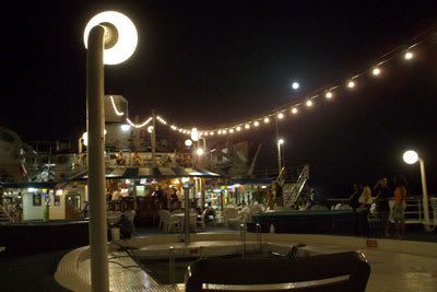 On deck onboard the Regal Empress, at night.