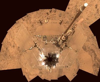 An overhead image that SPIRIT took of itself.  Today, its solar panels are almost completely covered by martian dust.