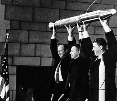 A model of Explorer 1, held by NASA Jet Propulsion Laboratory Director William Pickering, scientist James Van Allen and rocket pioneer Wernher von Braun in 1958.