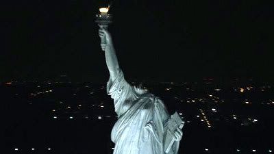 The Statue of Liberty lies headless in the cold New York night.