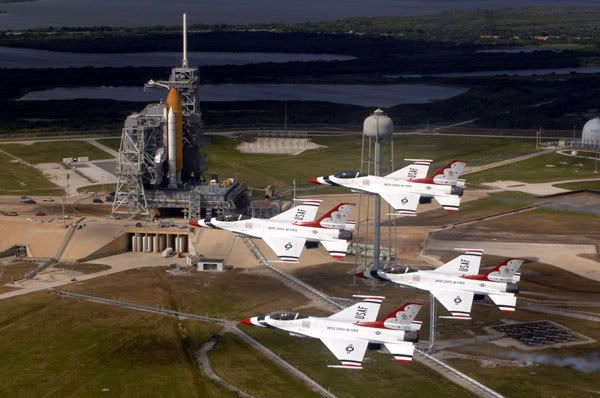 The U.S. Air Force's Thunderbirds fly over Endeavour at its launch pad to commemorate NASA's 50th anniversary.  The flyby took place around 7:15 AM, PST, today.