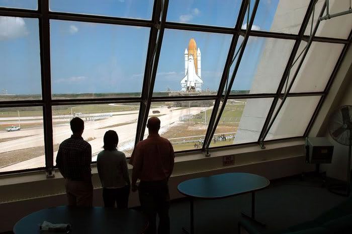 Space Shuttle Discovery rolls out to its launch pad.