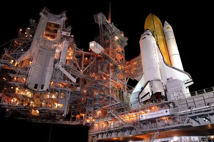 Space Shuttle Discovery arrives at its launch pad.