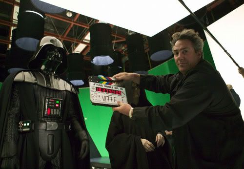Producer Rick McCallum poses with the slate as Darth Vader (Hayden Christensen) and Emperor Palpatine (Ian McDiarmid) look on.