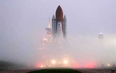 In today's morning fog, Space Shuttle Atlantis rolled out to Launch Pad 39B in preparation for the next space station assembly flight, STS-115.