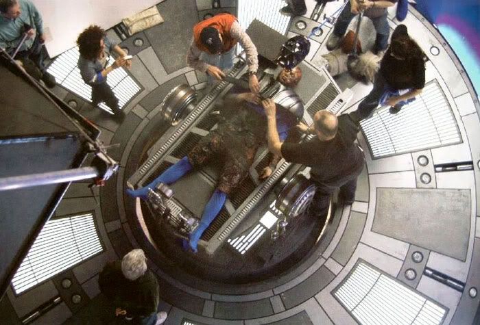 Lucas' film crew setting up a shot of Hayden Christensen lying on a operating table where Vader will be born.