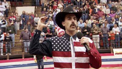 Borat sings his own version of the U.S. national anthem at a rodeo.