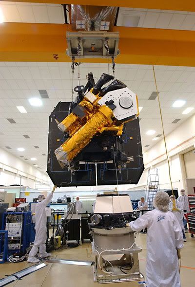 The Deep Impact flyby spacecraft is about to be mated with the Impactor (resting on the floor)
