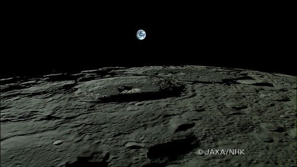 The Earth rises above the lunar horizon in this video screenshot from the Kaguya spacecraft.