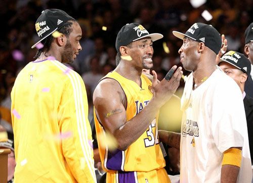 Ron Artest and Kobe Bryant congratulate each other as Josh Powell looks on...after the Lakers defeated the Boston Celtics, 83-79, in Game 7 of the NBA Finals.