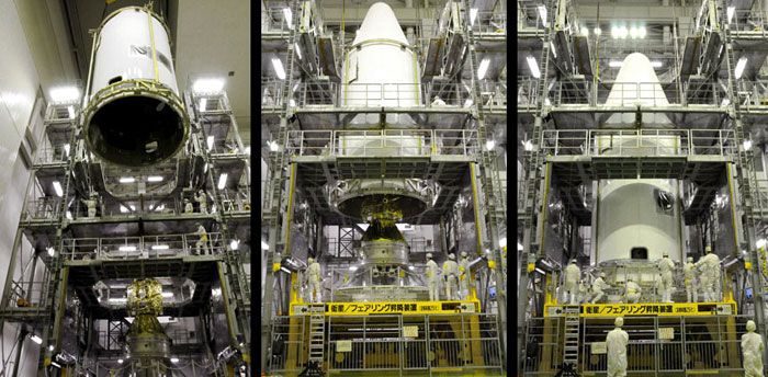 The payload fairing for the H-IIA rocket is encapsulated around the Akatsuki spacecraft and IKAROS solar sail inside the Spacecraft and Fairing Assembly building (May 4, Japan Time).