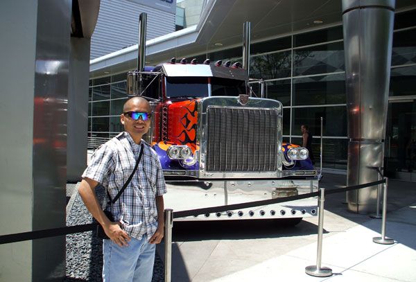 Posing in front of the Peterbilt truck that represents Optimus Prime in TRANSFORMERS 3.