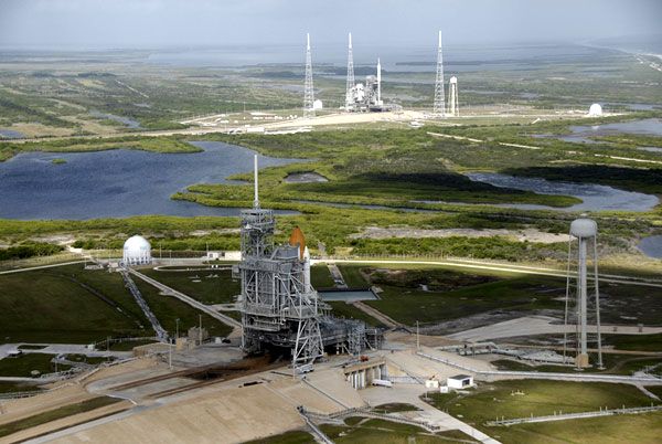 Space shuttle ATLANTIS (foreground) and ARES I-X (background) at Kennedy Space Center's Launch Complex 39, on October 23, 2009.