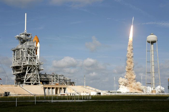 With space shuttle ATLANTIS in the foreground, the ARES I-X rocket successfully lifts off from Launch Complex 39B at NASA's Kennedy Space Center in Florida, on October 28, 2009.