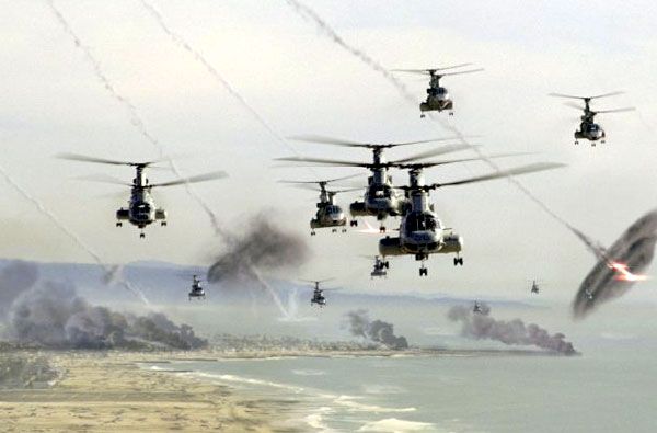 Marine helicopters fly along the Southern California coastline as artificial meteors explode all around them in BATTLE: LOS ANGELES.