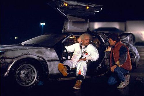 Doc Brown (Christopher Lloyd) and Marty McFly (Michael J. Fox) talk about time travel outside the Twin Pines Mall in BACK TO THE FUTURE.
