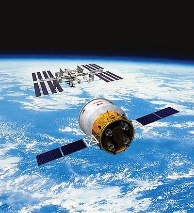 An artist's concept of the Cygnus spacecraft approaching the International Space Station.