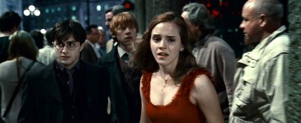 Harry Potter, Hermione Granger and Ron Weasley attempt to elude Lord Voldemort's minions in Part 1 of HARRY POTTER AND THE DEATHLY HALLOWS.