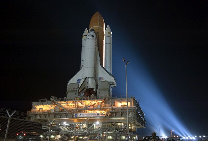 Xenon spotlights focus on space shuttle Discovery as it heads back to Launch Complex 39A (LC-39A) at the Kennedy Space Center in Florida, on January 31, 2011.