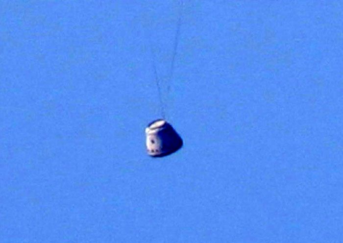 A close-up of the Dragon spacecraft just as it is about to splash down into the Pacific Ocean on December 8, 2010...following the completion of its maiden flight.