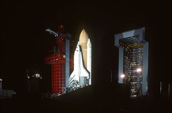 A nighttime shot of space shuttle Enterprise sitting atop its SLC-6 launch pad at Vandenberg Air Force Base in California.
