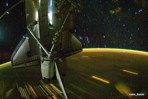 A surreal shot of space shuttle Discovery docked to the International Space Station (ISS), on April 13, 2010.