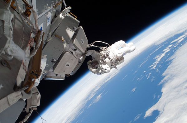 Astronaut Nicholas Patrick works on the newly-unveiled Cupola.