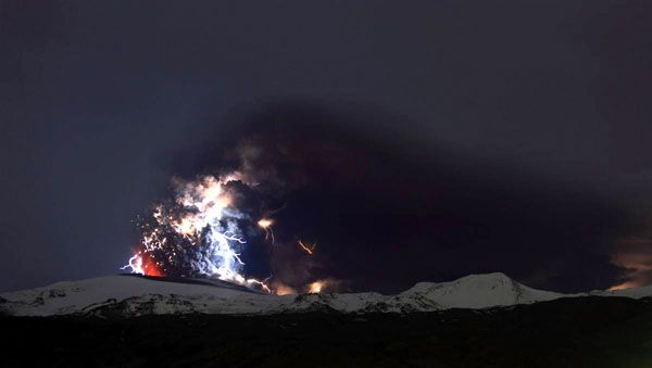 Lightning envelops a plume of ash that comes out of the Eyjafjallajokull volcano in Iceland, on April 18, 2010.