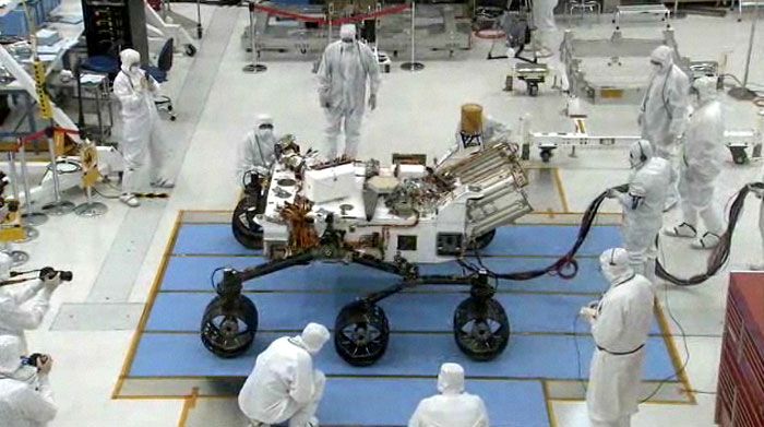 JPL engineers watch as the CURIOSITY Mars Rover is driven for the first time on July 23, 2010.