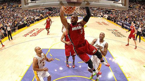Dwyane Wade scores a dunk against the Lakers as the Miami Heat defeats the NBA champions, 96-80, on December 25, 2010.