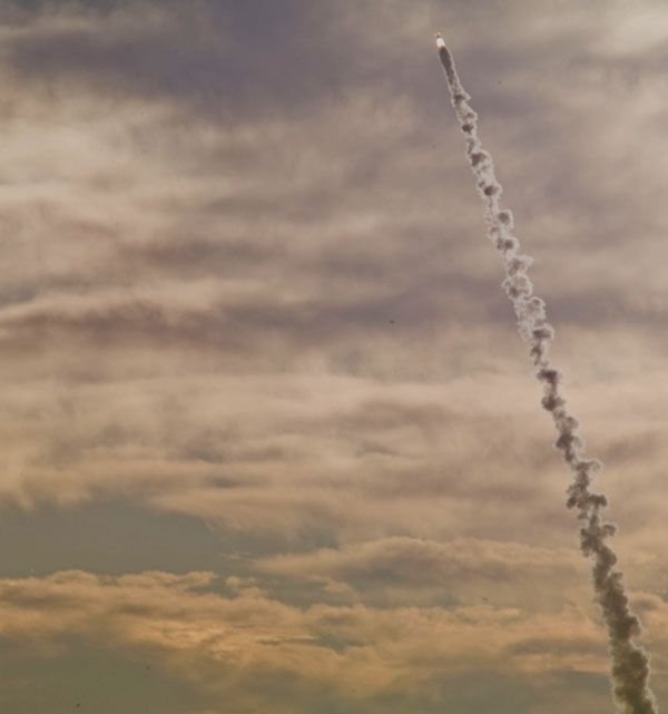 The mock-up Orion spacecraft and the launch abort system take off on the PA-1 test.