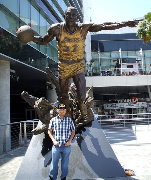Posing in front of the Magic Johnson statue at STAPLES Center on June 19, 2010.  I'm wearing the Lakers' official 2010 championship baseball cap.