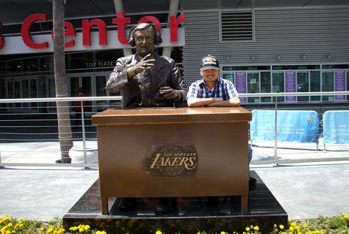 Posing next to the statue of the late Lakers broadcaster Chick Hearn at STAPLES Center on June 19, 2010.