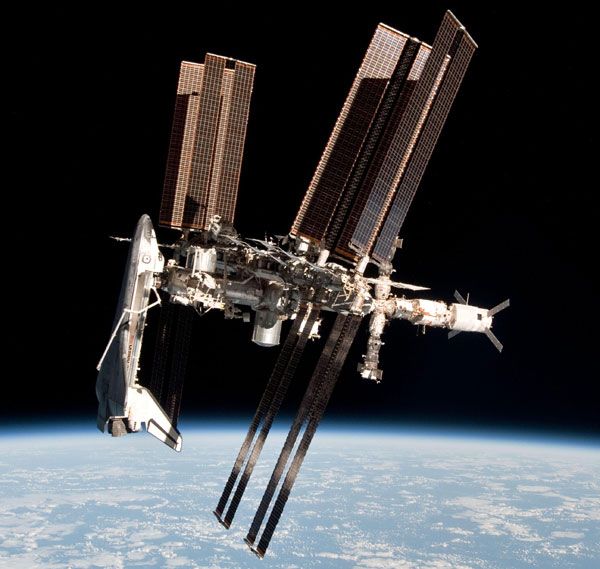 The International Space Station with the orbiter Endeavour docked to it, as seen from a Russian Soyuz vehicle after it undocked from the ISS on May 23, 2011.