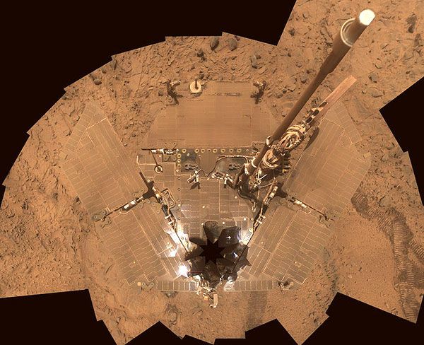 A self-portrait of the Spirit rover, now covered in Martian dust, in October of 2007.
